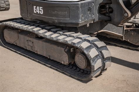 mini excavator w rubber tracks|installing track on mini excavator.